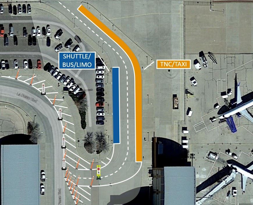 Aerial view of Ground Transportation Area showing Shuttle/Bus/Limo pickup zone on the left and TNC/Taxi pickup zone on the right, located at the north end of the terminal near Baggage Claim