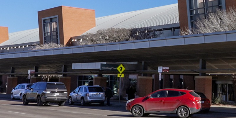 The covered passenger pick-up and drop-off curb outside the MAF terminal